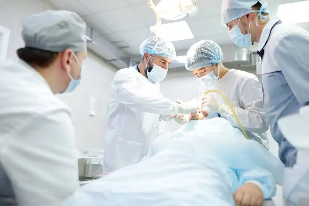 Surgical team performing jaw surgery illustrating surgical orthodontics treatment in Brooklyn with coordinated care